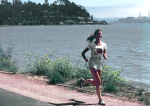 17081-a-woman-running-along-a-lake-shore-pv
